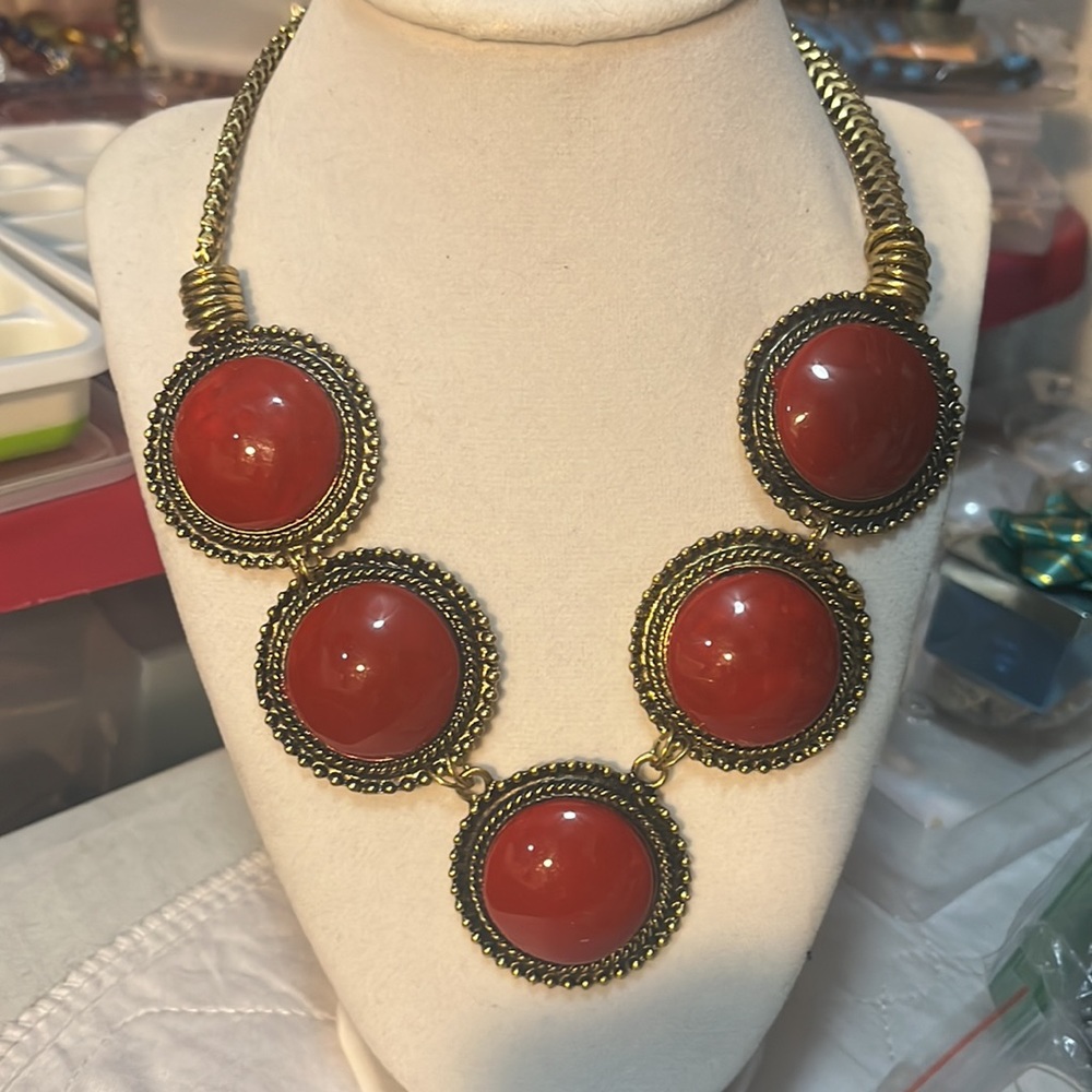 Statements Necklace With Cranberry Colored Stones.